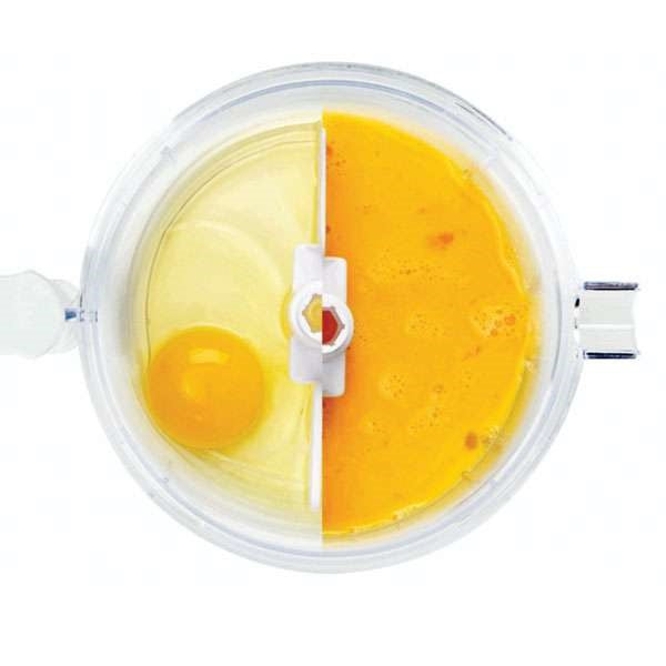 top view of small food processor with half whole egg yolks and half blended egg yolks