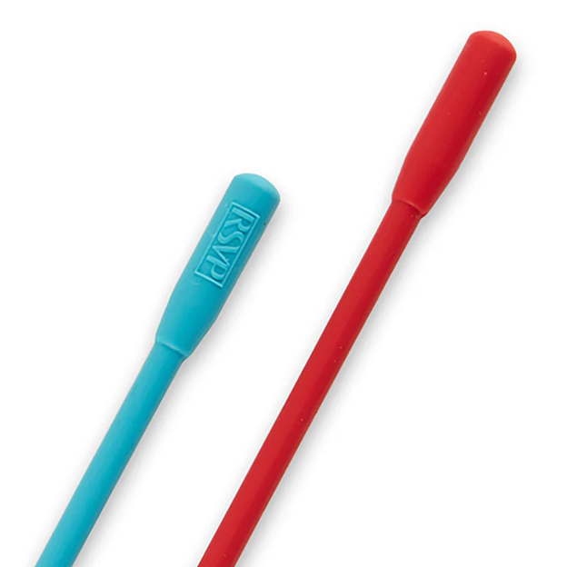 closeup of the handles of two long handle silicone stirring spoons, red and blue